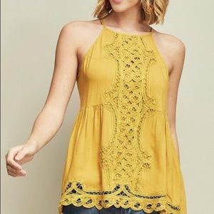 Crochet top with button closure on neck.